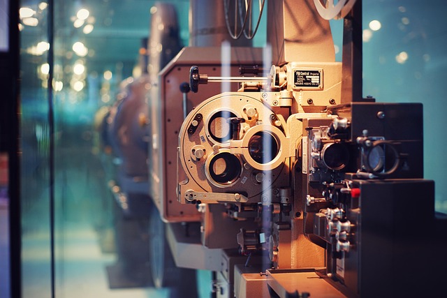 A close-up of a vintage film projector, showcasing the classic cinematic equipment.